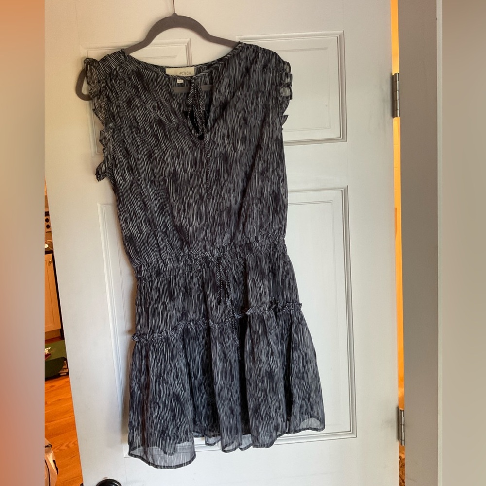 Stylish Black with pattern mini dress from boutique. Cinched waist.